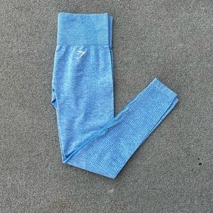 Women’s blue Gymshark athletic leggings with logo